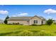 Charming home featuring a manicured lawn and back patio perfect for outdoor enjoyment at 520 Winged Elm St., Loris, SC 29569