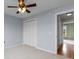 A clean bedroom featuring a closet and neutral carpet with views into the hallway at 520 Winged Elm St., Loris, SC 29569