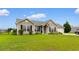 Well-maintained one-story house featuring manicured front yard and attractive landscaping at 520 Winged Elm St., Loris, SC 29569