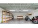 Spacious garage with shelving units, work bench, sink, water heater, and motorcycles at 520 Winged Elm St., Loris, SC 29569