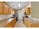 Spacious kitchen with oak cabinets, stainless steel refrigerator, and modern appliances at 520 Winged Elm St., Loris, SC 29569