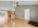 Spacious living room featuring beautiful hardwood floors and a ceiling fan at 520 Winged Elm St., Loris, SC 29569