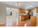 Bright open-concept living space featuring seamless flow between kitchen and living room at 520 Winged Elm St., Loris, SC 29569