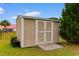 Exterior view of a spacious shed providing extra storage with double doors and a ramp at 520 Winged Elm St., Loris, SC 29569