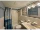 Bathroom with a shower-tub combo, vanity, and ample lighting at 5409 N Ocean Blvd. # 111, North Myrtle Beach, SC 29582
