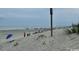 Beautiful sandy beach with blue umbrellas, perfect for relaxing by the sea at 5409 N Ocean Blvd. # 111, North Myrtle Beach, SC 29582