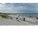 Serene beach scene with distant pier and sunny skies, a perfect seaside destination at 5409 N Ocean Blvd. # 111, North Myrtle Beach, SC 29582