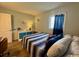 Cozy bedroom featuring a comfortable bed and relaxing decor at 5409 N Ocean Blvd. # 111, North Myrtle Beach, SC 29582