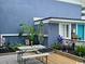 Charming outdoor patio with dining table and lush greenery, perfect for enjoying the sea air at 5409 N Ocean Blvd. # 111, North Myrtle Beach, SC 29582