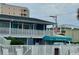 Exterior view of the property with a blue awning marked 'Hartford Inlet' in white with an American flag on the roof at 5409 N Ocean Blvd. # 111, North Myrtle Beach, SC 29582