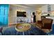 Comfortable living area equipped with modern amenities like a TV, retro arcade game, and a convenient mini-kitchenette at 5409 N Ocean Blvd. # 111, North Myrtle Beach, SC 29582