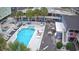 Aerial view of a sparkling pool area with lounge chairs and palm trees at 5409 N Ocean Blvd. # 111, North Myrtle Beach, SC 29582