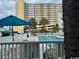 Inviting outdoor pool with lounge chairs and umbrellas, perfect for relaxation at 5409 N Ocean Blvd. # 111, North Myrtle Beach, SC 29582