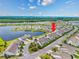 Aerial view showcases lakeside townhomes in a well-planned community with mature trees at 5475 Elba Way # 1601, Myrtle Beach, SC 29579