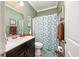 Cozy bathroom featuring wood cabinets and decorative wall art at 5475 Elba Way # 1601, Myrtle Beach, SC 29579