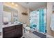A bathroom featuring a vanity with dark wood cabinets and white marble counter top, complemented by a decorative shower curtain at 5475 Elba Way # 1601, Myrtle Beach, SC 29579