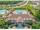 Aerial view of the elegant community clubhouse, with inviting pool and surrounding green spaces at 5475 Elba Way # 1601, Myrtle Beach, SC 29579