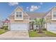 Charming townhouse featuring a well-maintained front yard with a lovely palm tree at 5475 Elba Way # 1601, Myrtle Beach, SC 29579