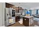 Modern kitchen with stainless steel appliances, granite counters, dark wood cabinetry, and a granite island at 5475 Elba Way # 1601, Myrtle Beach, SC 29579