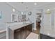 Spacious kitchen featuring a breakfast bar, stainless steel appliances, granite counters and dark wood cabinets at 5475 Elba Way # 1601, Myrtle Beach, SC 29579