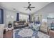 Inviting living room with vaulted ceiling, plush seating, natural light, and a decorative rug at 5475 Elba Way # 1601, Myrtle Beach, SC 29579