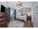 A cozy bedroom features a king-sized bed, ceiling fan, and sliding door leading to a patio at 5475 Elba Way # 1601, Myrtle Beach, SC 29579