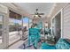 Bright sunroom with cozy seating, a ceiling fan, and access to an outdoor patio at 5475 Elba Way # 1601, Myrtle Beach, SC 29579