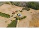 Expansive aerial view showcasing a property with lush ponds, outbuildings, and beautiful landscaping at 589 Loop Circle, Longs, SC 29568