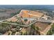 Breathtaking aerial view of a sprawling estate with ponds, fields, and a luxurious home at 589 Loop Circle, Longs, SC 29568