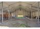 Spacious barn interior with metal framing, a dirt floor, and a view of the outdoors through the open end at 589 Loop Circle, Longs, SC 29568