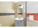Upstairs half bath featuring a single sink vanity and a view into the adjacent room at 589 Loop Circle, Longs, SC 29568
