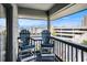 Balcony view featuring chairs, a table, and views of the inter coastal waterway and parking garage at 6000 N Ocean Blvd. # 329, North Myrtle Beach, SC 29582