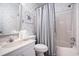 A bathroom with patterned wallpaper and shower/tub at 6000 N Ocean Blvd. # 329, North Myrtle Beach, SC 29582