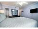 Bright bedroom featuring a comfortable queen bed, wood-look floors, and closet access at 6000 N Ocean Blvd. # 329, North Myrtle Beach, SC 29582