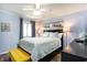 Cozy bedroom with a queen-size bed, soft lighting, and wood-look flooring at 6000 N Ocean Blvd. # 329, North Myrtle Beach, SC 29582
