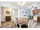 Open-concept dining room featuring wood-look floors, recessed lights and access to the kitchen at 6000 N Ocean Blvd. # 329, North Myrtle Beach, SC 29582