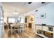 Spacious dining area adjacent to the living room and kitchen featuring durable wood-look floors at 6000 N Ocean Blvd. # 329, North Myrtle Beach, SC 29582
