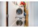 A compact laundry area with a stacked washer and dryer at 6000 N Ocean Blvd. # 329, North Myrtle Beach, SC 29582