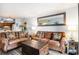 Cozy living room with wood-look floors and leather sofa at 6000 N Ocean Blvd. # 329, North Myrtle Beach, SC 29582