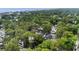 Aerial view showcases a charming neighborhood with lush greenery and stunning ocean views at 6001 - 1498 S Kings Hwy., Myrtle Beach, SC 29575