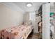 Well-lit bedroom with pink Hello Kitty bedding, and closet storage at 6001 - 1498 S Kings Hwy., Myrtle Beach, SC 29575