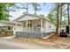 Charming home with a cozy front porch and space for parking at 6001 - 1498 S Kings Hwy., Myrtle Beach, SC 29575