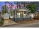 Charming home featuring a covered porch, neutral siding, and well-maintained front yard at 6001 - 1498 S Kings Hwy., Myrtle Beach, SC 29575