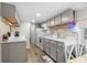 Open kitchen with grey cabinets, a view to the dining area and modern appliances at 6001 - 1498 S Kings Hwy., Myrtle Beach, SC 29575