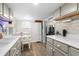 Well-lit kitchen with grey cabinets, a dining area, and a functional layout at 6001 - 1498 S Kings Hwy., Myrtle Beach, SC 29575