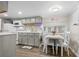 Cozy kitchen and dining area with white cabinets and natural light at 6001 - 1498 S Kings Hwy., Myrtle Beach, SC 29575