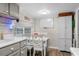 Eat-in kitchen features grey cabinets, modern appliances, and a built-in pantry for ample storage at 6001 - 1498 S Kings Hwy., Myrtle Beach, SC 29575