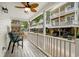 Relaxing porch view with seating and a ceiling fan for comfort at 6001 - 1498 S Kings Hwy., Myrtle Beach, SC 29575