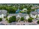 Aerial view of the condo complex showcasing a beautiful community with lush landscaping, a serene pond, and well-maintained buildings at 601 Hillside Dr. N # 3704, North Myrtle Beach, SC 29582