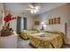 Inviting bedroom with two beds, floral arrangements, and a decorative ceiling fan at 601 Hillside Dr. N # 3704, North Myrtle Beach, SC 29582